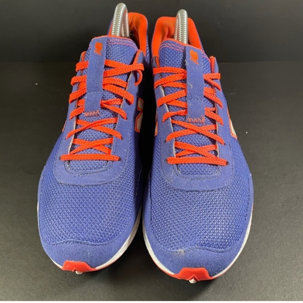 Women's New Balance Purple and Orange Turf shoes size 8